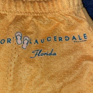 Wings Exist Beach store Beach shorts yellow athletic mesh Ft. Lauderdale Florida